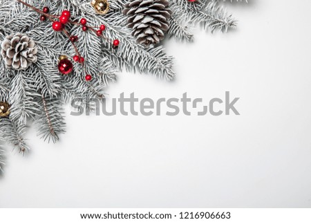 Christmas card. White background with snow fir tree and decoration. Top view with copy space for your text