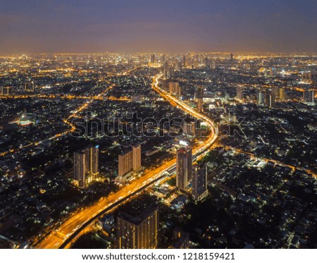 Aerial view of Sathorn, Bangkok Downtown. Financial district and business centers in smart urban city in Asia. Skyscraper and high-rise buildings at night. Thailand