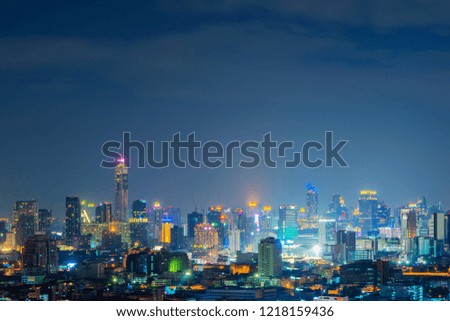 Aerial view of Sathorn, Bangkok Downtown. Financial district and business centers in smart urban city in Asia. Skyscraper and high-rise buildings at night. Thailand