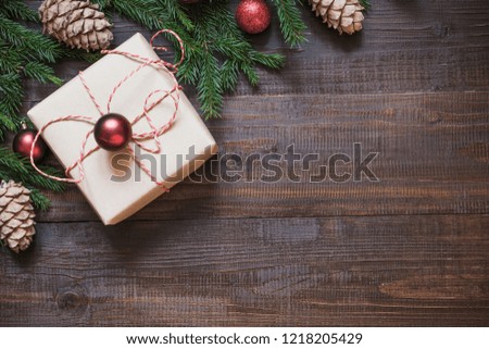 Christmas holiday gift and decoration on wooden board. Holiday card with copy space. Top view.