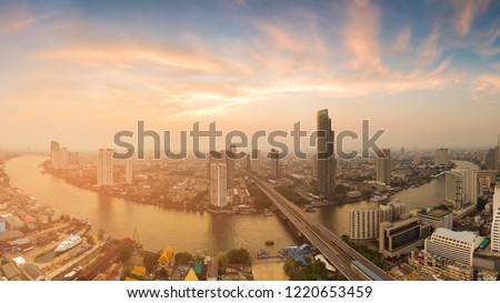Panorama Bangkok city river curved skyline with after sunset sky, Thailand