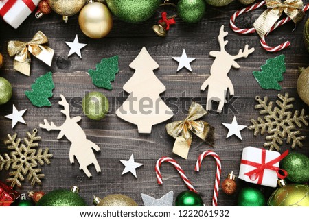 Colorful christmas decorations with wooden fir tree and deers