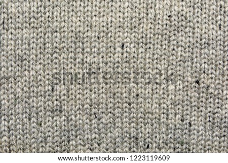 The texture of the knitted gray fabric for the background    