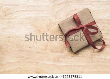 Gifts for special moments flat lay with copy space on wooden background