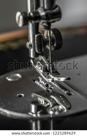 Sharp needle off sewing machine close up.