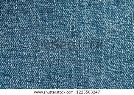 The texture of denim is shot with a large increase in macro.