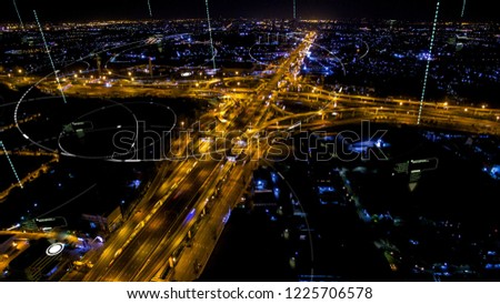 Futuristic digital broadcasting, gps location signals and data connectivity in the cityscape at night time