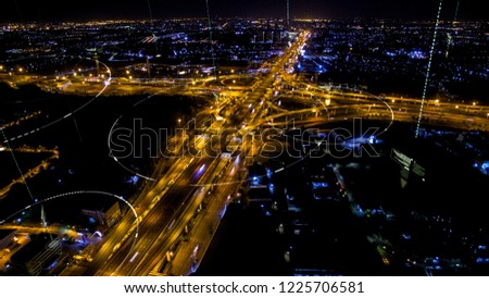 Futuristic digital broadcasting, gps location signals and data connectivity in the cityscape at night time