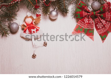 Christmas tree with Christmas toys. Balls and doll.