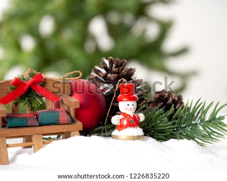 Decorative Christmas ornaments on a snowy surface