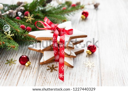 Christmas cookies and Christmas tree on a old wooden table