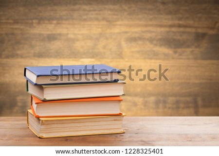 Stack of books on table at library