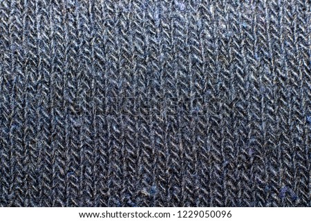 Texture of blue knitted fabric close up