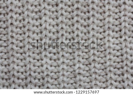 Grey knitted fabric texture for background.