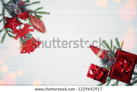 christmas background and decoration with fir branches gift boxes on white wooden board