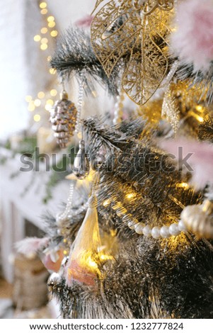 Elegant New year and Christmas tree with toys, balls and lights