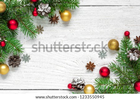 christmas decoration. fir branches, gift boxes, decorations and pine cones on white wooden table covered with snow. Christmas background. Flat lay. top view with copy space