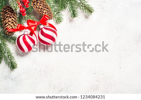 Christmas background with fir tree, red balls and decorations on white  background. Top view with copy space.