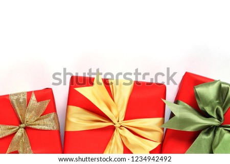 Red gift box isolated on white with close-up for design in Christmas work concept.
