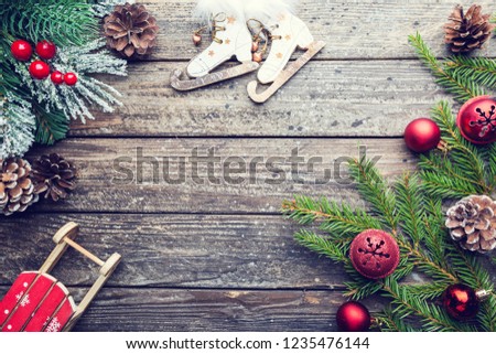 Christmas wooden background with fir tree and decorations. Top view with copy space