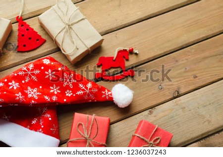 Christmas decoration on wooden board red and brown colors.
