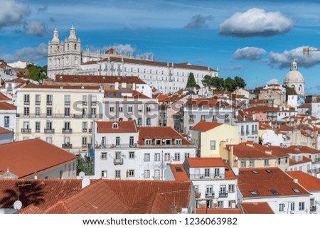 Aerial view of Lisbon skyline with Pantheon and Sao Vicente Church on a beautiful sunny day with clouds, Portugal.