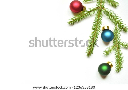 Christmas decoration ball and fir branch over white background