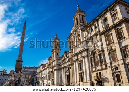 The Fontana Dei Quattro Fiumi designed in 1651 by Gian Lorenzo Bernini, in Piazza Navona, the ancient Stadium of Domitian, in Rome, Italy. Church of Sant'Agnese in Agone in the background.