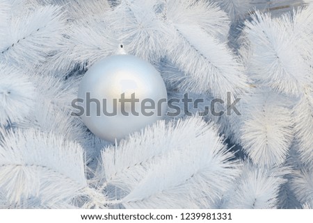 ฺBall on white christmas tree background.
