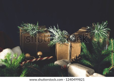Christmas ornaments with gift boxes on wooden table. Rustic Christmas background. Wrapping presents background