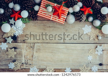 Christmas background with gift boxes and decorations on the wood