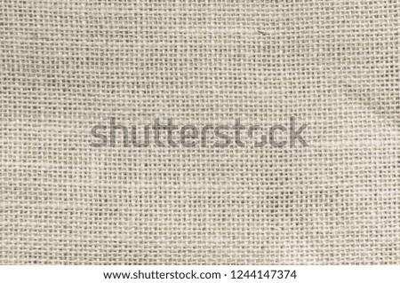Vintage abstract Hessian or sackcloth fabric or hemp sack texture background. Cream Wallpaper of artistic wale linen canvas. Blanket or Curtain of cotton pattern with copy space for text decoration.