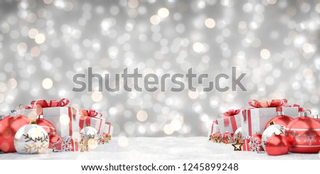 Red christmas gifts and baubles lined up on grey background 3D rendering