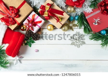 Gift boxes with Xmas tree on rustic wooden background, top view, copy space