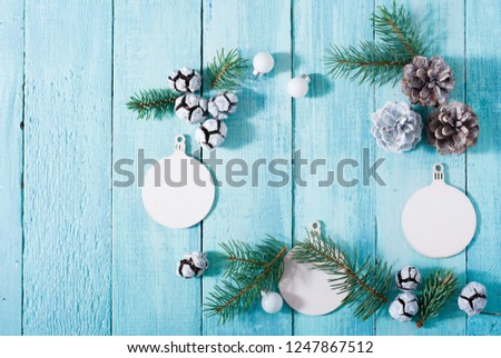 Christmas ornaments frame on blue shabby chic wooden table background