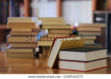 Close-up of books stacked on library table book stack is the background selective focus and shallow depth of field