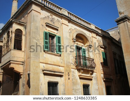 Building with traditional maltese balcony in historical part of Mdina.