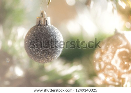 Christmas bulbs and decorations on christmas tree 
