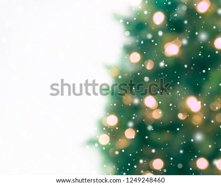 Abstract defocused  Christmas tree with defocused bokeh lights, holiday  background.