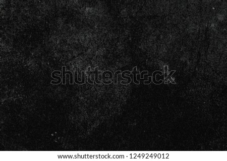 Black background with gray spots. Grunge and vintage backdrop.