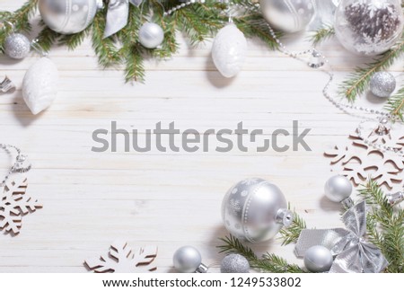 Silver Christmas decoration on wooden background