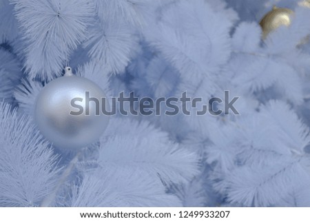 white Christmas tree with golden and white ornaments