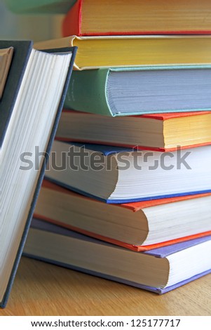 Rough pile of books in covers of various colors