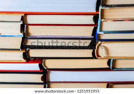 Stack of books background, many books piles with copy space for text