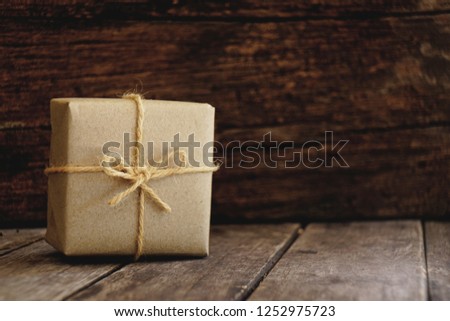 Eco friendly gift boxes wrapped with brown paper, green happy new year present concept, copy space