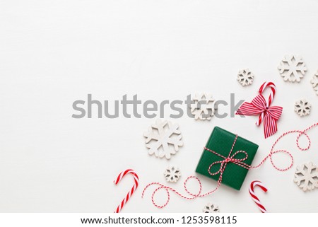 Christmas greeting card. Festive decoration on white wooden background. New Year concept. Copy space.  Flat lay. Top view.