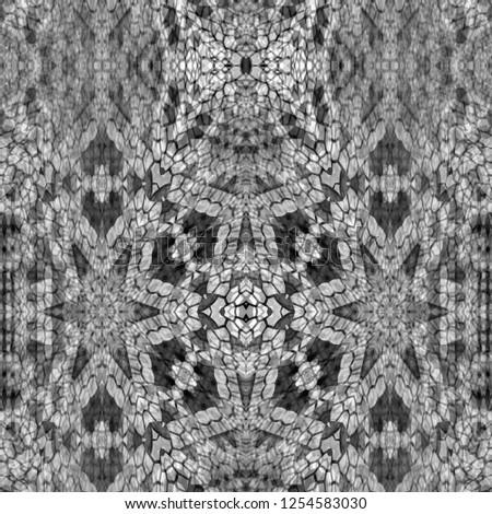 Black and white abstract geometric kaleidoscope pattern for textiles and design.