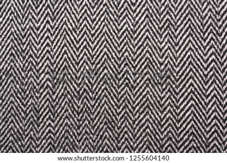 Herringbone  Tweed coat background. Gray warm, soft wool fabric