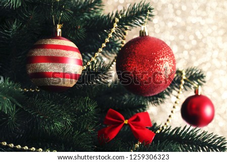 Christmas tree with decorations on blurred background