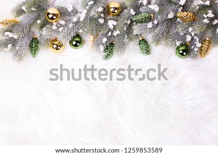 Frame from gold and green  pine cones and branches fir tree  on fur background.  Decorative christmas composition. Selective focus. Place for text. Top view.